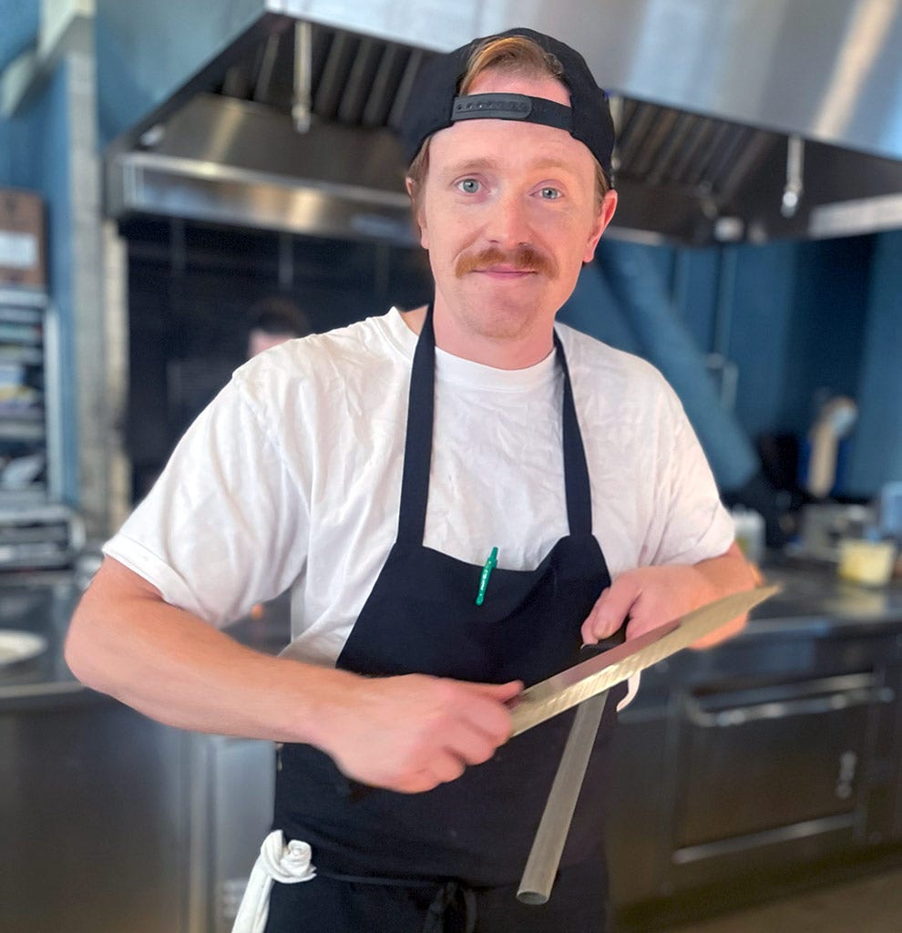 Chef Mike Conrad stands in his kitchen at Restaurant Lena in Detroit. Click to read his interview.