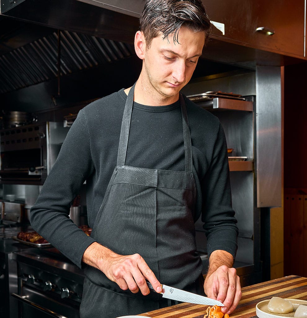 Chef Nate Hobart slices a vibrant havanada pepper using the Shun Dual Core 6&rdquo; Utility Knife. Click to read his interview.