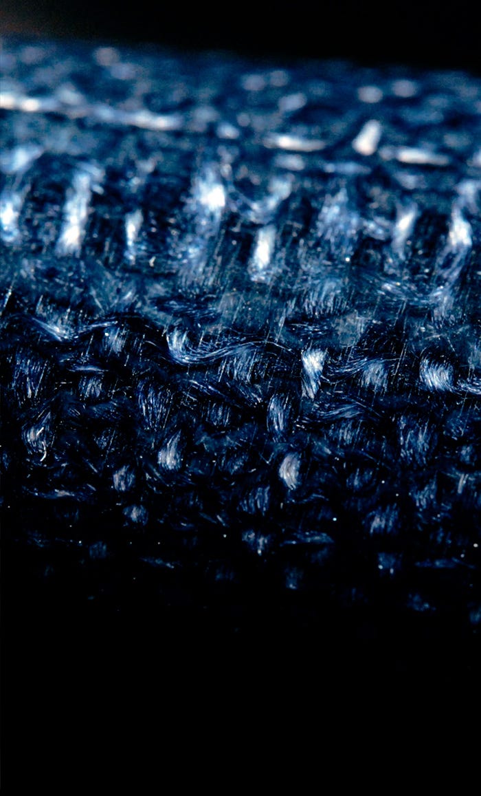 Close-up of Prussian blue jute micarta handle material used on Shun Shiranami knives