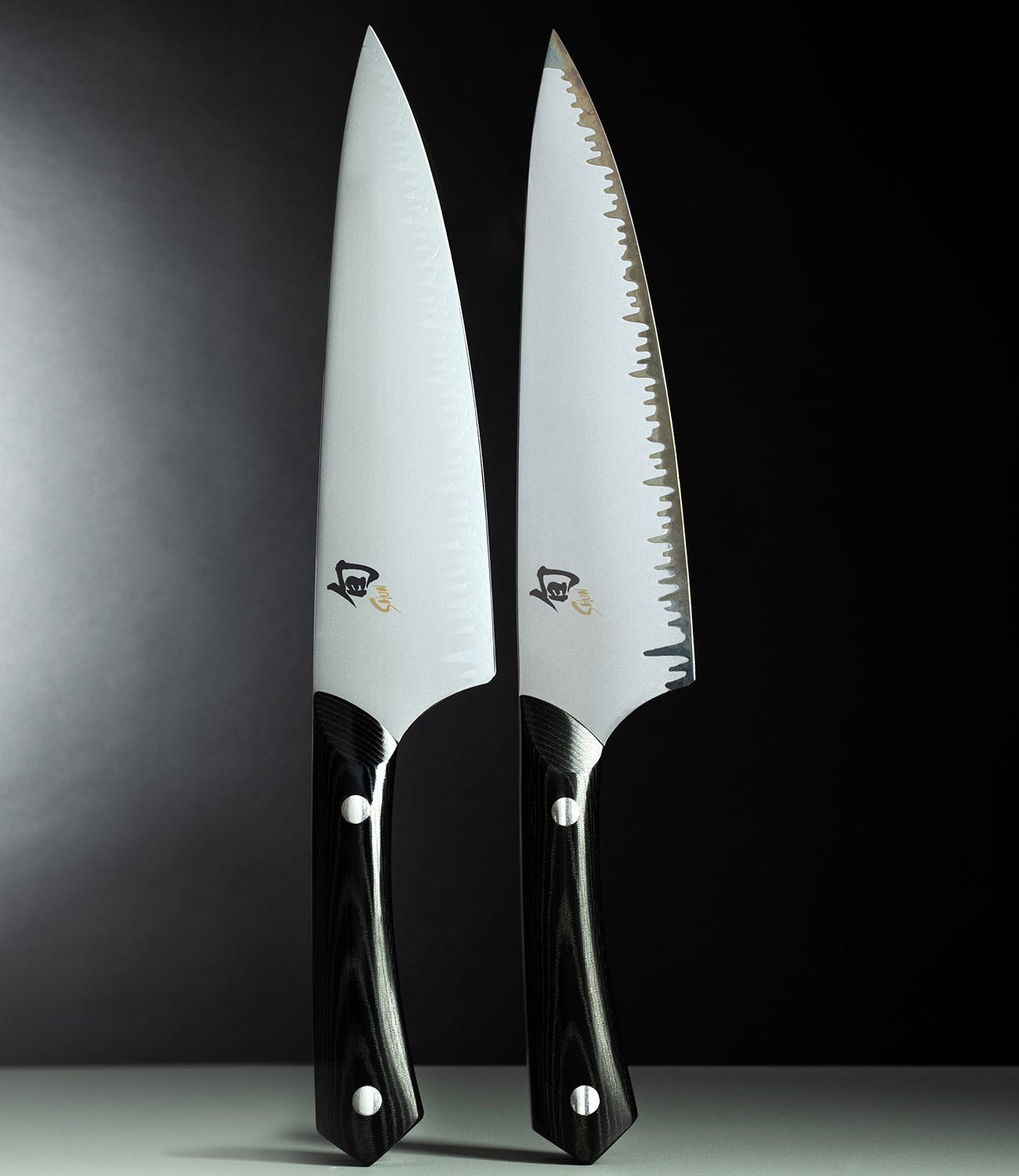 Two Narukami Shun knives shown side by side, one new and one with a developed patina.